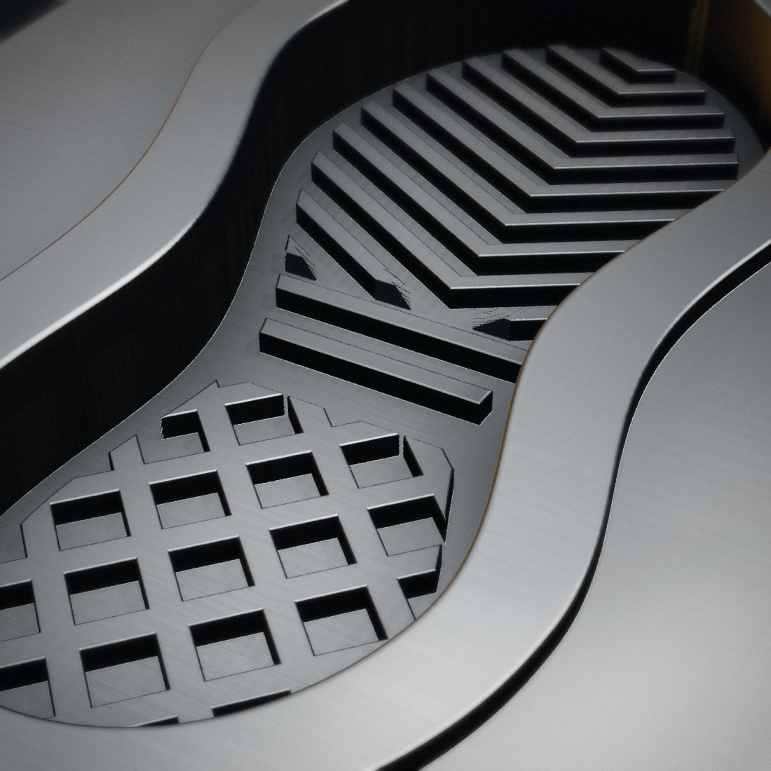 Close-up of a CNC-machined tread pattern inside an aluminium sole mould